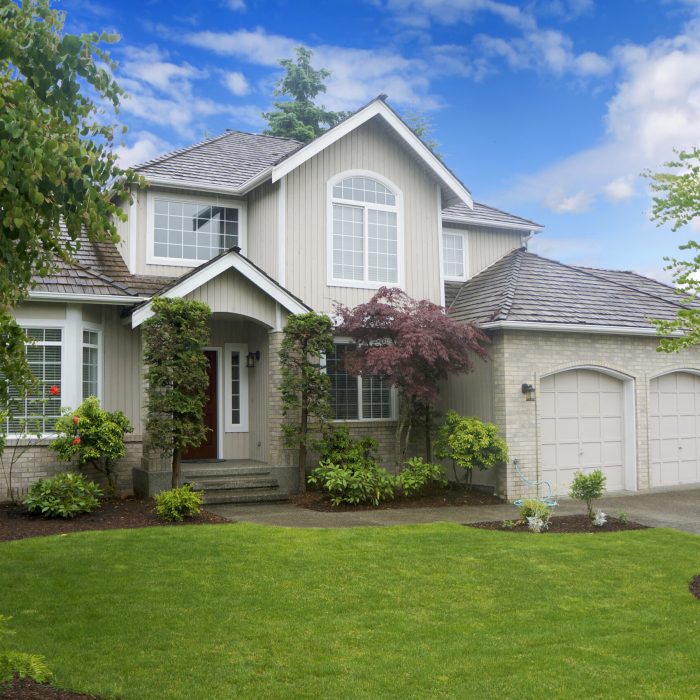 Large classic American house with three car garage.